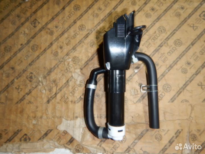 Форсунка омывателя фары левая Outlander XL