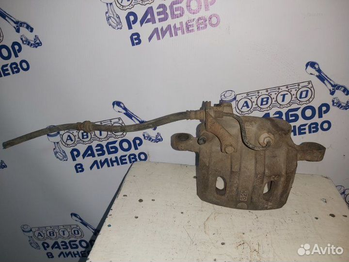 Суппорт тормозной левый Mitsubishi Pajero 2 2G72