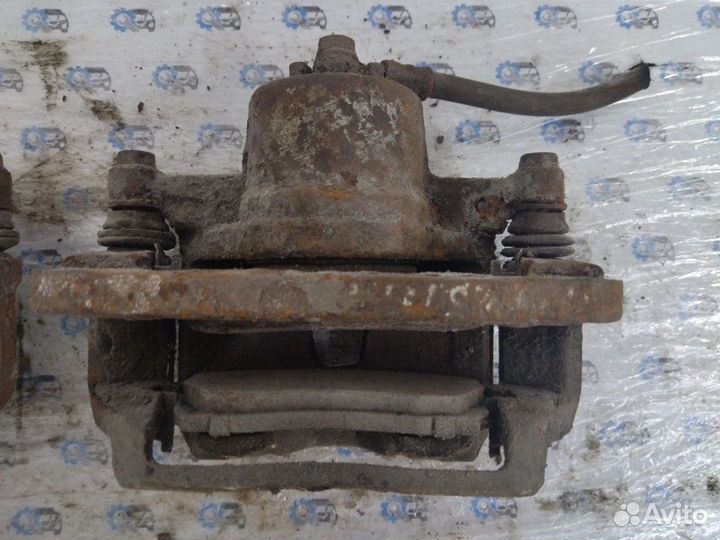 Суппорт передний Mazda 323 Bj