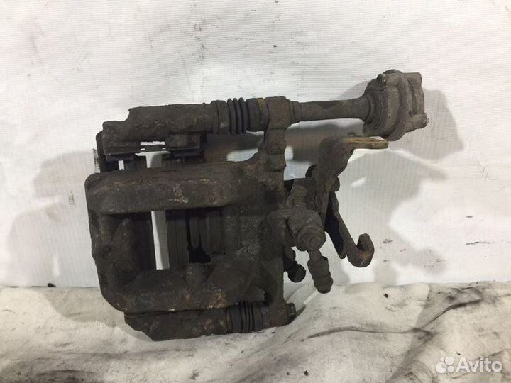 Суппорт тормозной задний правый Opel Astra J До