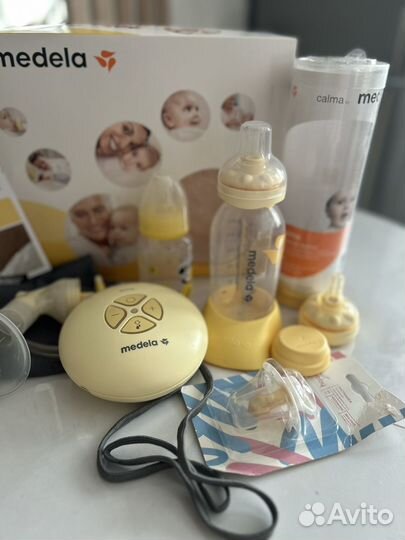 Молокоотсос medela электрический