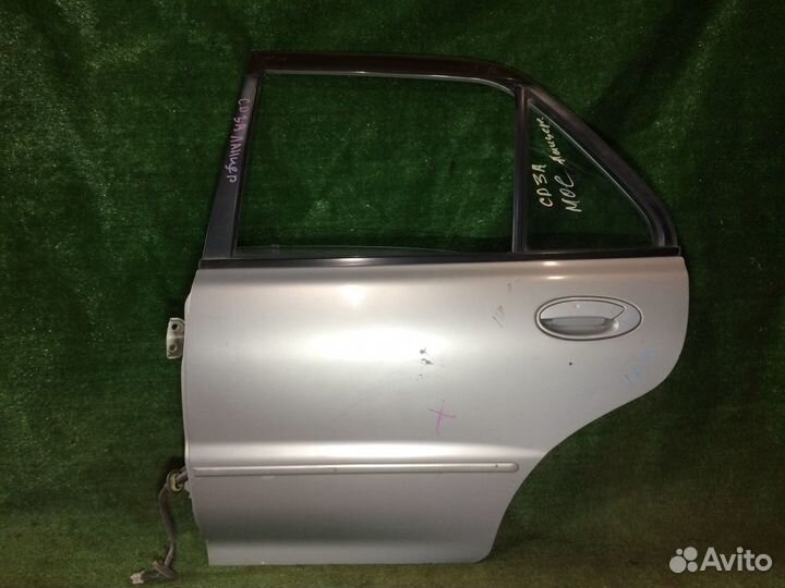 Дверь задняя левая Mitsubishi Lancer CB CD Серебро