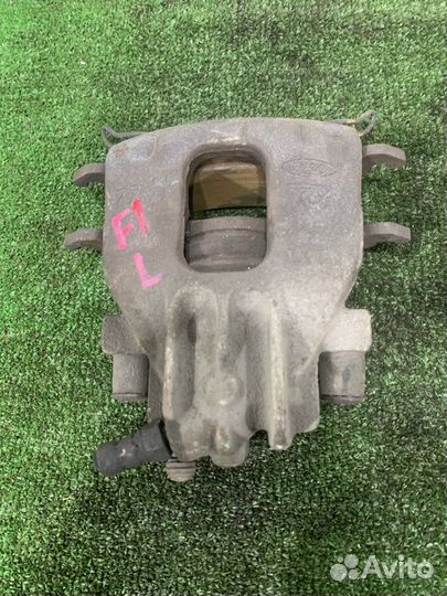 Суппорт тормозной передний Ford Focus седан 1.8