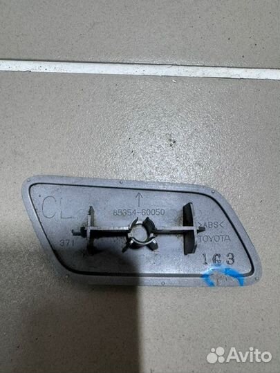 Крышка форсунки омывателя фар левая Toyota Land