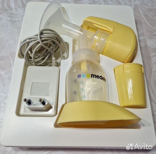 Молокоотсос medela электрический