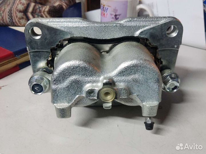 Суппорт левый mazda L20633990B