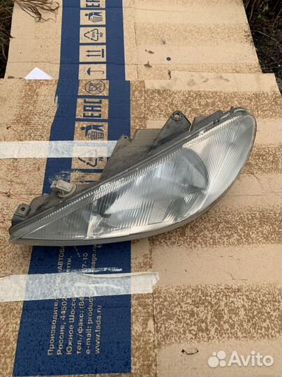 Фара левая Peugeot 206