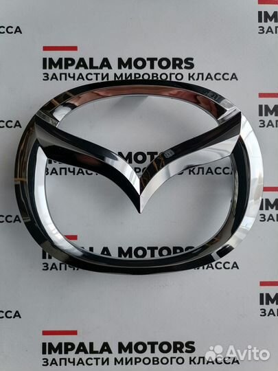 Эмблема решетки радиатора Mazda 3/6 flest