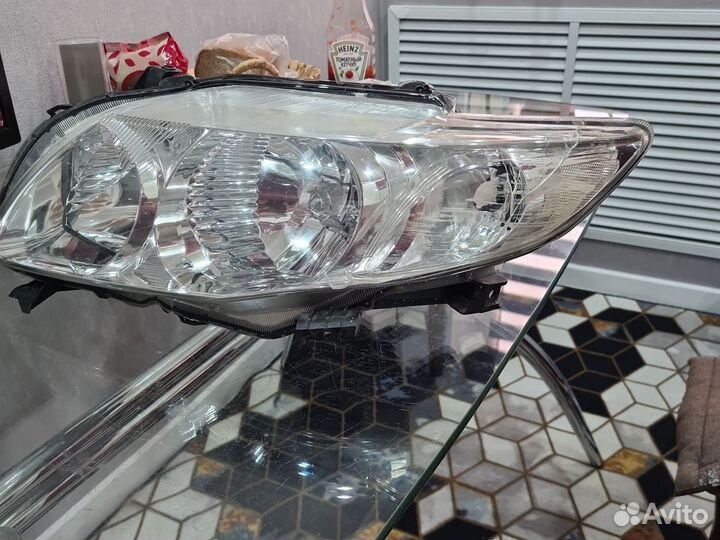 Фара передняя правая toyota corolla 150