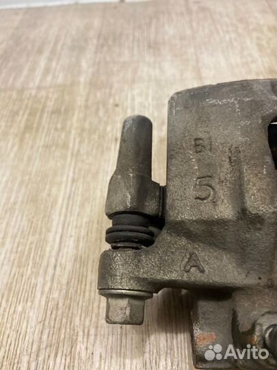 Суппорт задний левый Mitsubishi Lancer 10 CY3A