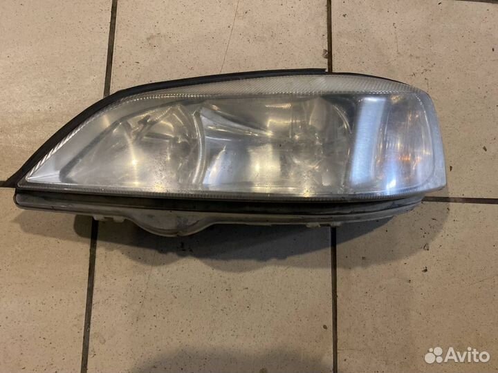 Фара левая Opel Astra G