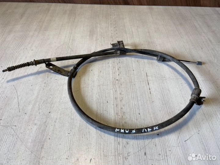 Трос стояночного тормоза левый Kia Rio 3