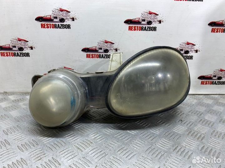 Фара галогеновая передняя левая Kia Shuma лифтбек