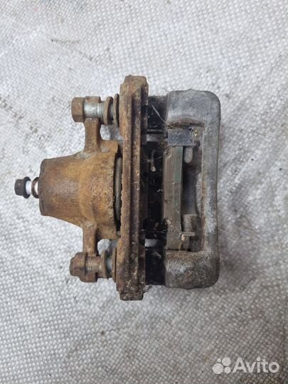 Суппорт тормозной задний левый Хендай Соната 6