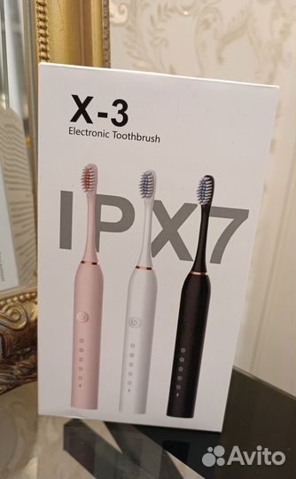 Электрическая зубная щетка