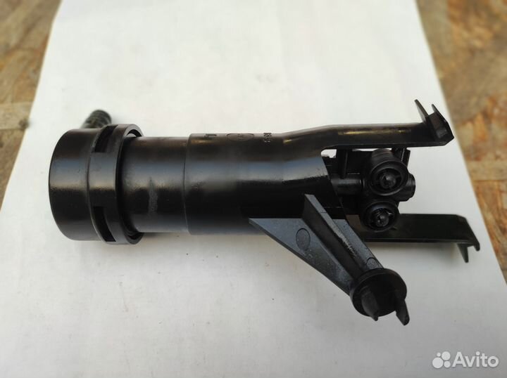 Нижняя часть омывателя фар левый Nissan Almera N16