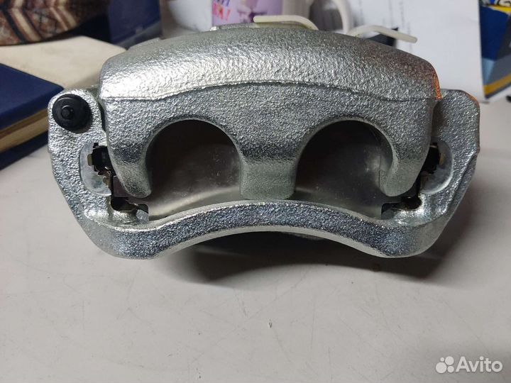 Суппорт левый mazda L20633990B