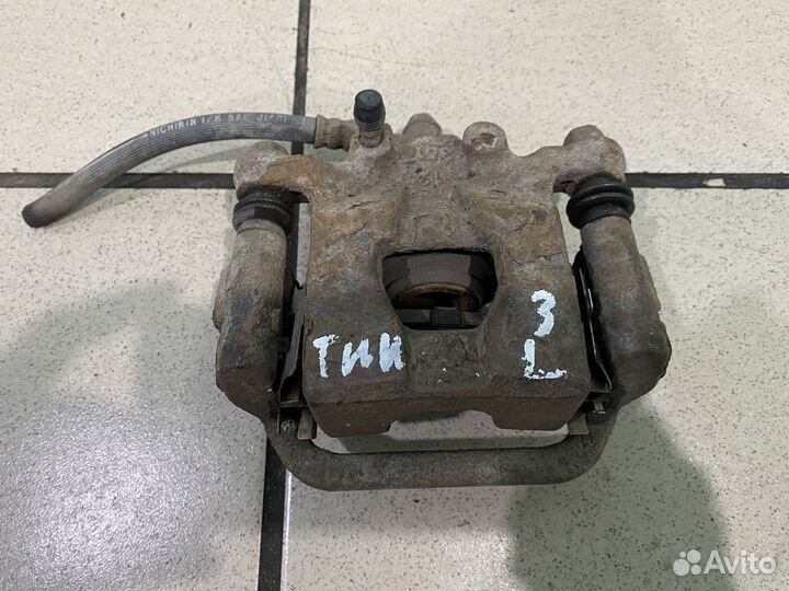 Тормозной суппорт задний левый Nissan tiida C11