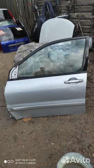 Мицубиси лансер 9 дверь передняя