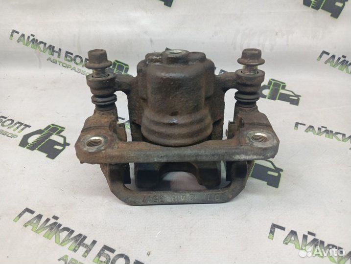 Суппорт тормозной задний левый Nissan Qashqai J10