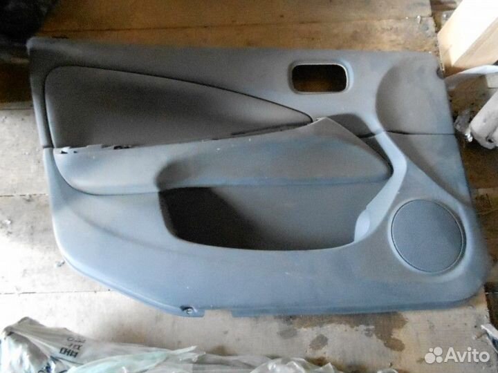 Обшивка двери передней левой Nissan Almera Classic