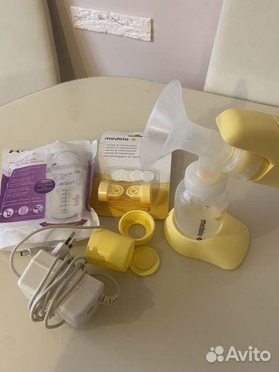 Молокоотсос medela электрический