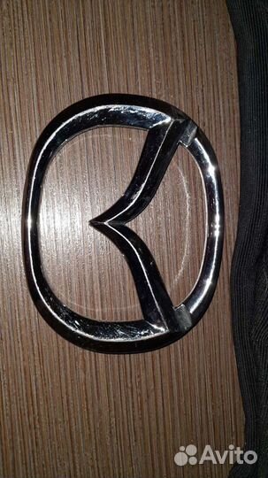 Эмблема мазда