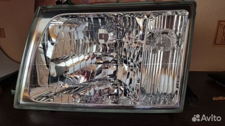 Фара левая на Toyota Land Cruiser 100