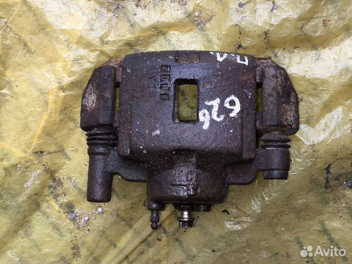 Суппорт тормозной передний Mazda 626 GE 91-97 гг