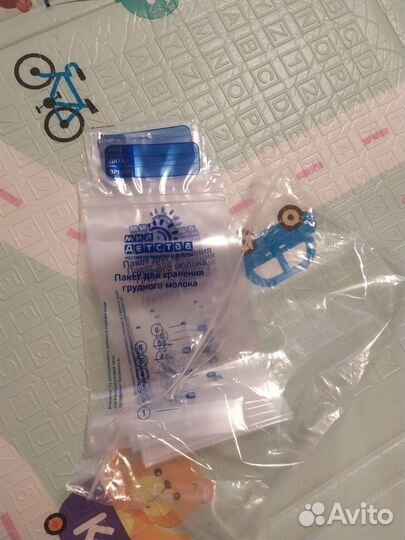 Молокоотсос ручной babygo + пакеты для молока