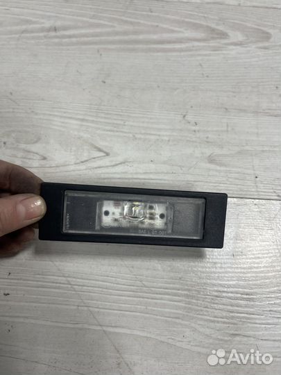 Фонарь подсветки номера на Bmw F20