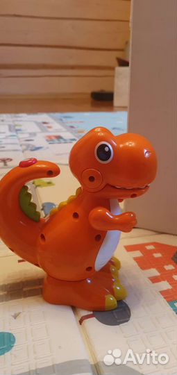 Игрушка динозавр со световым эффектом