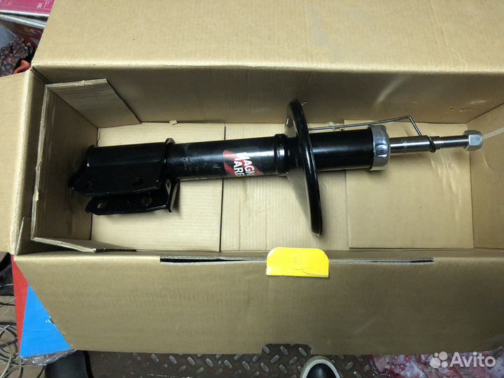 Стойка амортизатора передняя