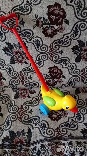 Игрушка каталка с ручкой