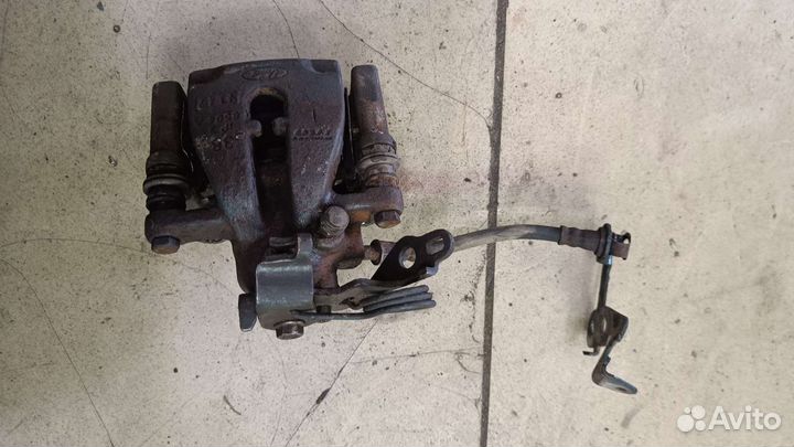 Суппорт тормозной задний левый Ford Mondeo 4