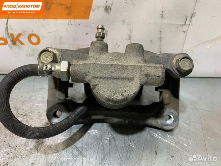 Суппорт тормозной задний правый Mitsubishi Lancer