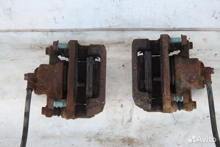 Суппорт тормозной задний левый Mazda CX7