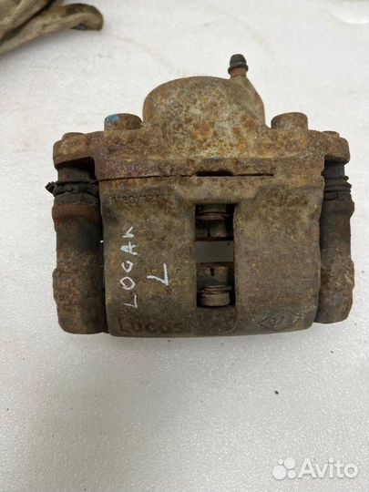 Суппорт тормозной передний левый Renault Logan