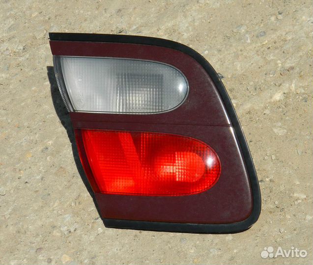 Фонарь багажника левый Almera N15