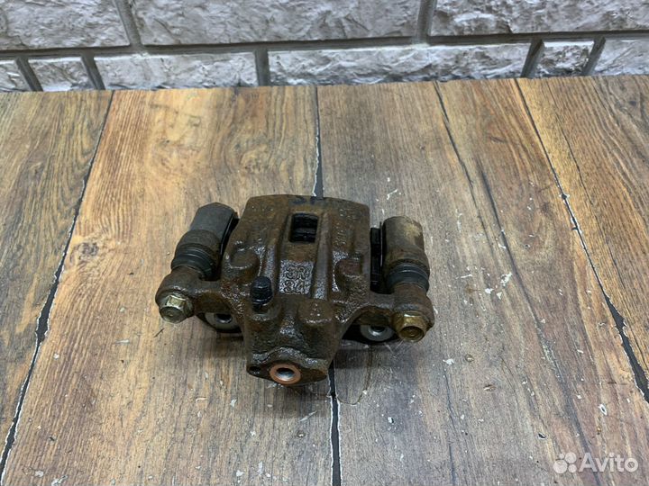 Kia Sportage Суппорт тормозной задний LH RH