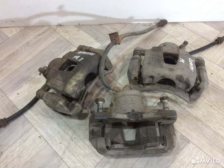 Суппорт тормозной передний левый Chevrolet Lacetti