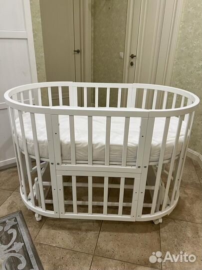 Детская кроватка трансформе с поперечным маятником