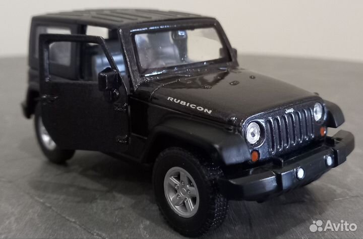 Модель автомобиля Jeep Wrangler Rubicon Welly ориг