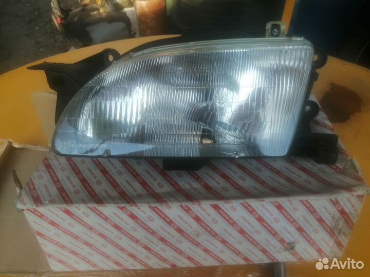 Новая оригинальная фара левая Kia Avella