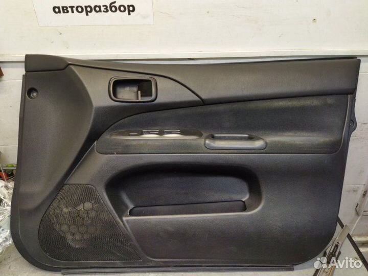 Обшивка двери передняя правая Mitsubishi Lancer 9