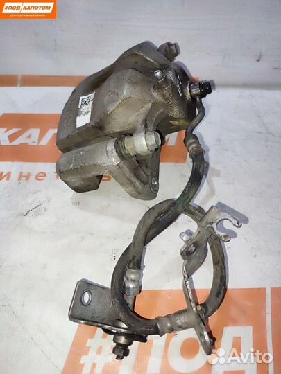 Суппорт тормозной передний левый Kia Sportage 4