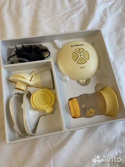 Молокоотсос medela электрический