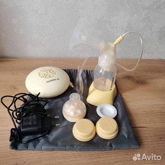 Молокоотсос medela электрический