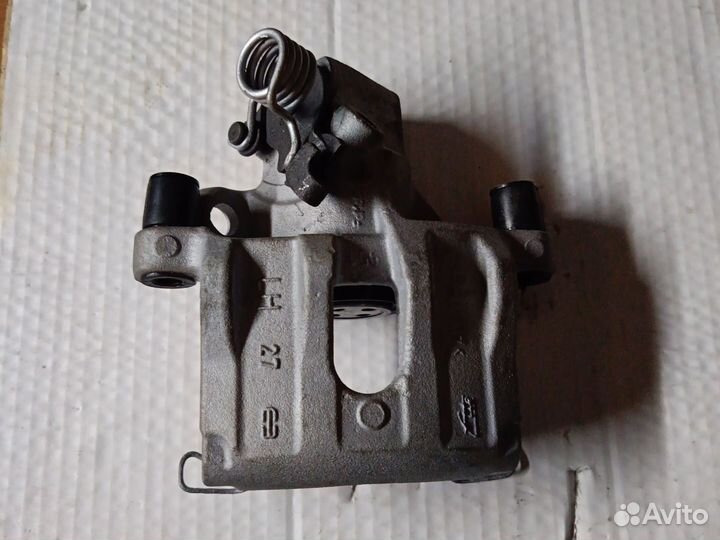 Суппорт задний левый ford Mazda Volvo