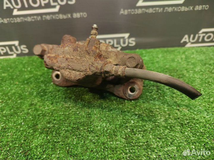 Суппорт задний левый Mitsubishi Lancer X седан 1.8